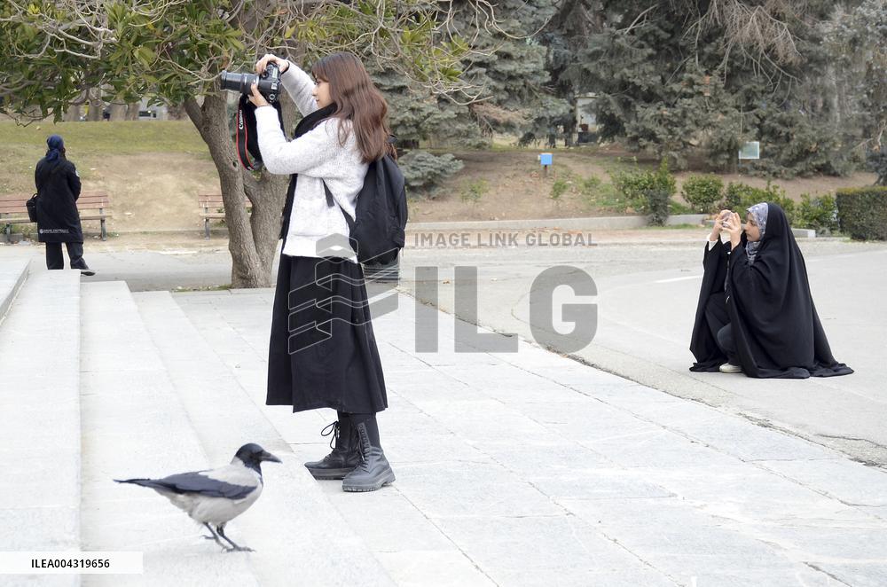 Iranian women defy the strict hijab laws in the street of Tehran
