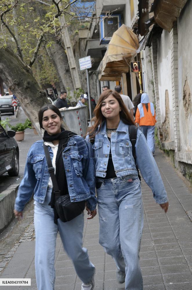 Iranian women defy the strict hijab laws in the street of Tehran