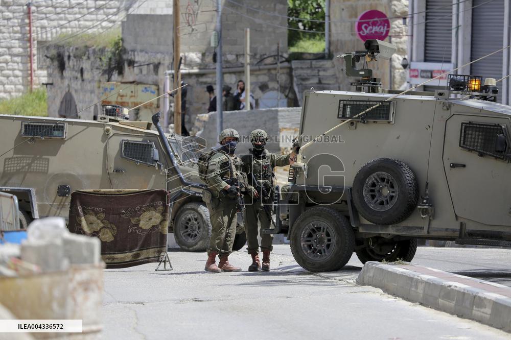 Israeli forces block the streets during Passover in Hebron