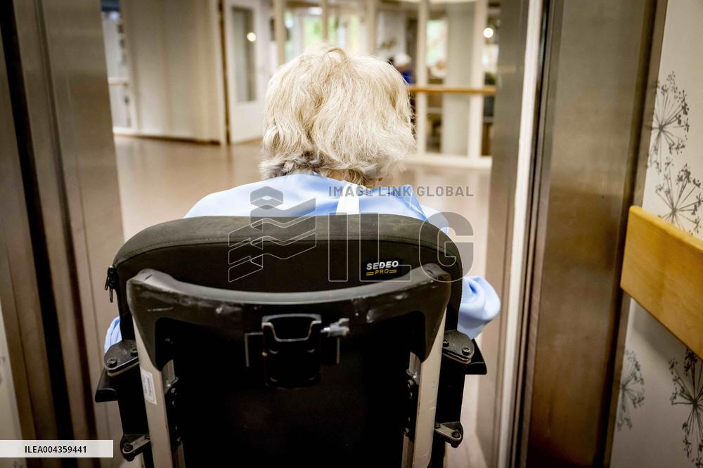Elderly Woman In Wheelchair Illustrations - Netherlands