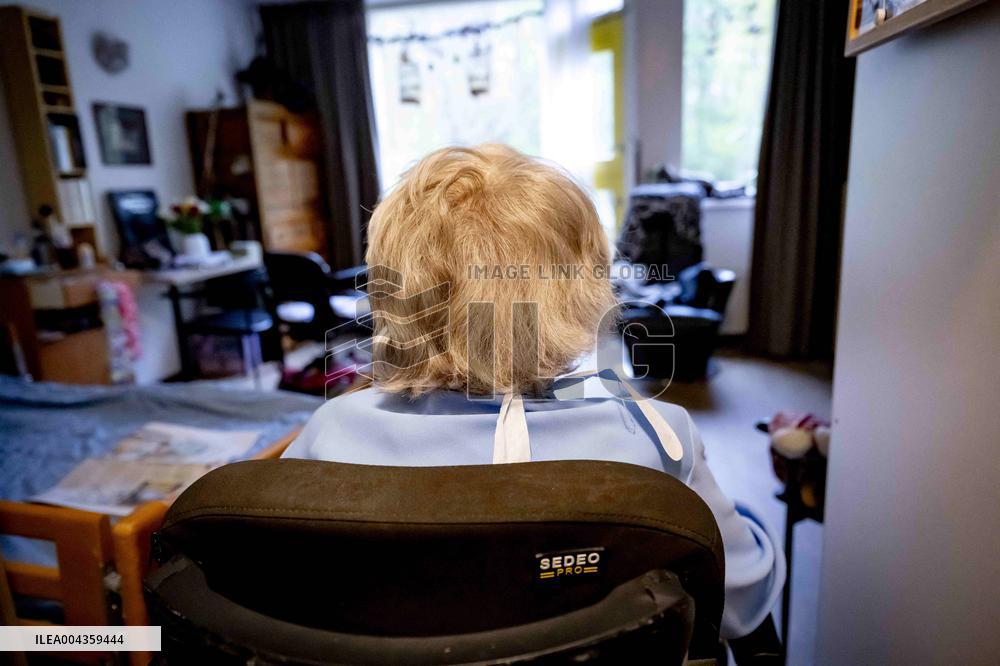 Elderly Woman In Wheelchair Illustrations - Netherlands