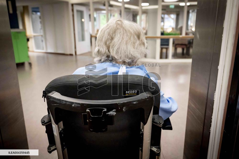 Elderly Woman In Wheelchair Illustrations - Netherlands