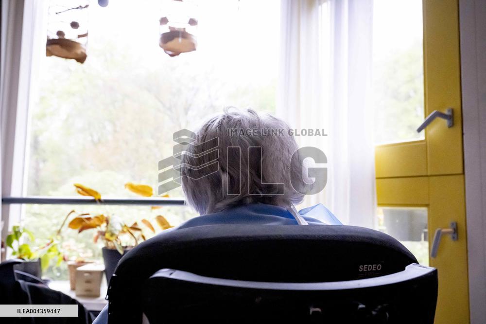 Elderly Woman In Wheelchair Illustrations - Netherlands