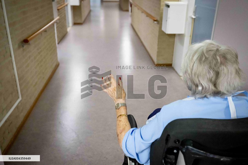 Elderly Woman In Wheelchair Illustrations - Netherlands