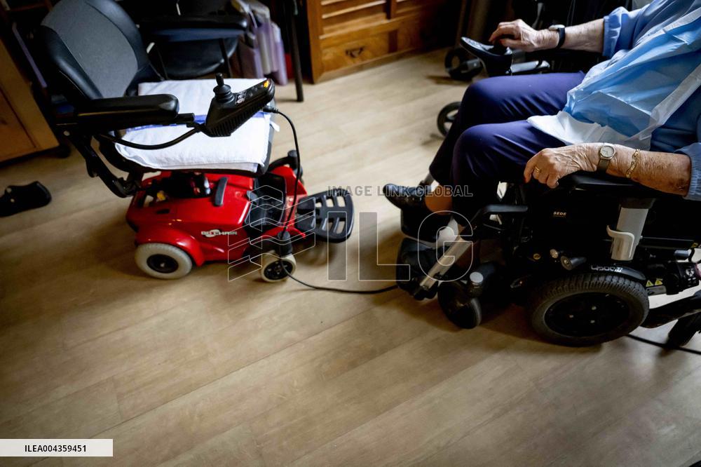 Elderly Woman In Wheelchair Illustrations - Netherlands