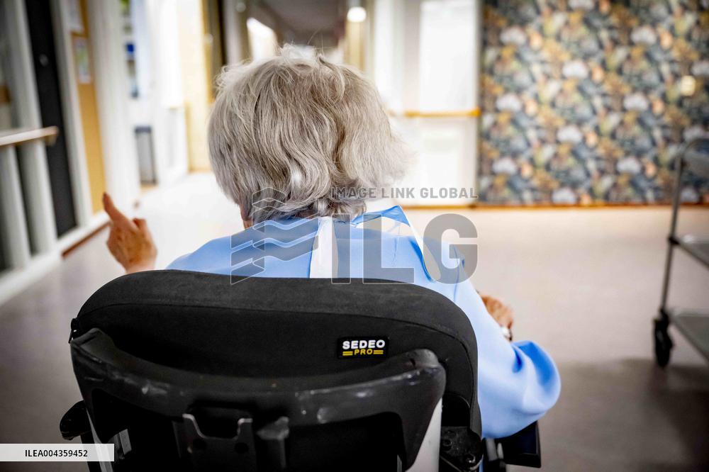 Elderly Woman In Wheelchair Illustrations - Netherlands
