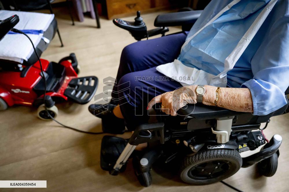 Elderly Woman In Wheelchair Illustrations - Netherlands