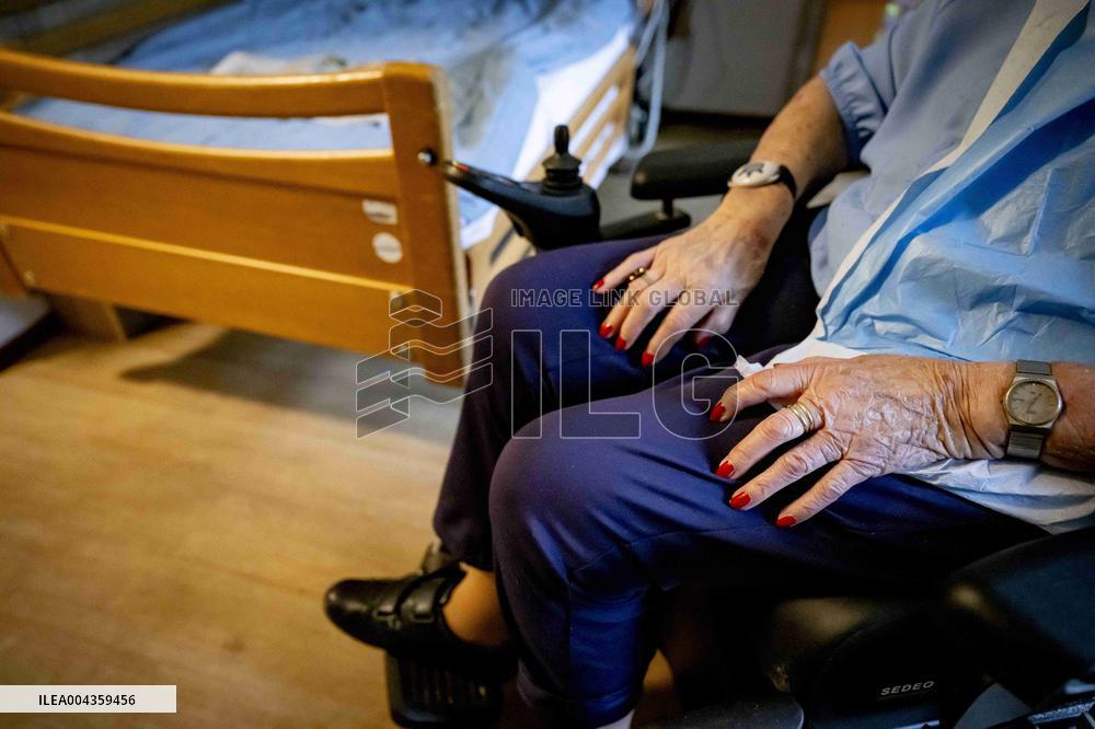 Elderly Woman In Wheelchair Illustrations - Netherlands