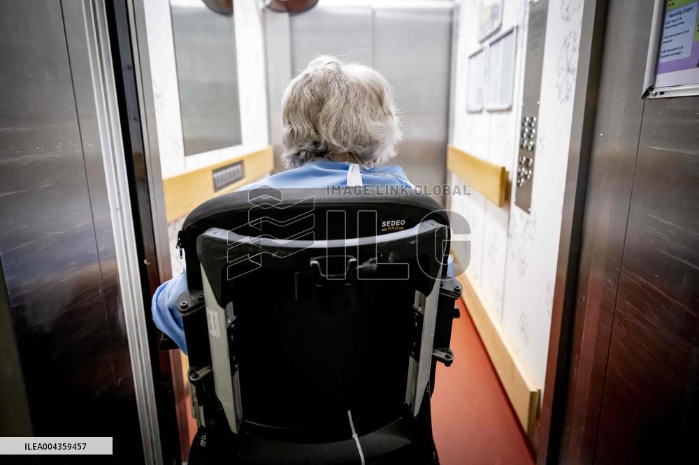 Elderly Woman In Wheelchair Illustrations - Netherlands