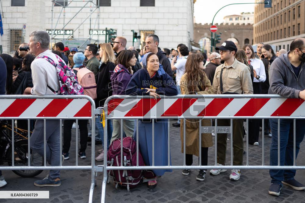 People queue at St Peter Basilica to pay their respects to late Pope Francis - Rome