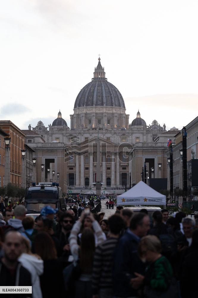 People queue at St Peter Basilica to pay their respects to late Pope Francis - Rome