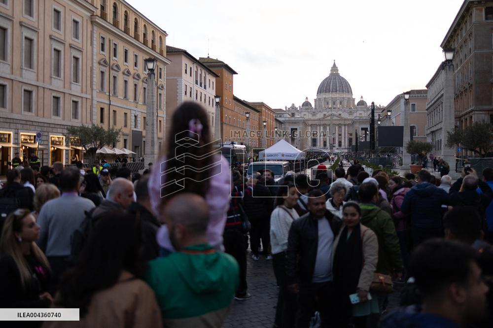 People queue at St Peter Basilica to pay their respects to late Pope Francis - Rome