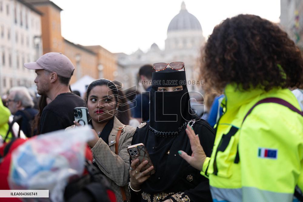 People queue at St Peter Basilica to pay their respects to late Pope Francis - Rome