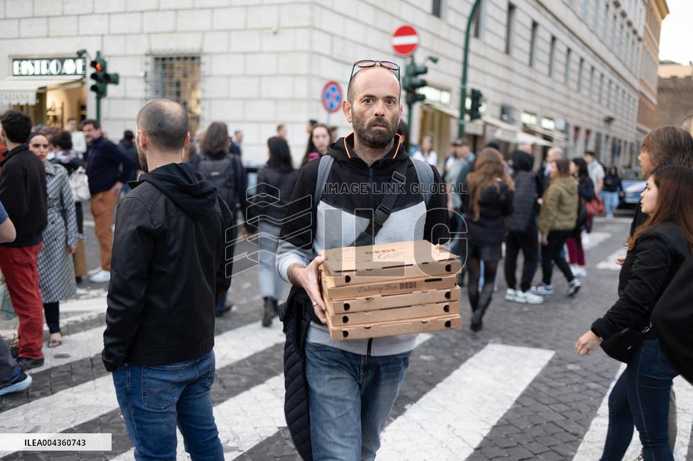 People queue at St Peter Basilica to pay their respects to late Pope Francis - Rome