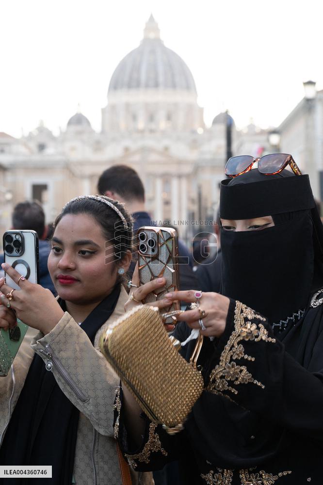 People queue at St Peter Basilica to pay their respects to late Pope Francis - Rome