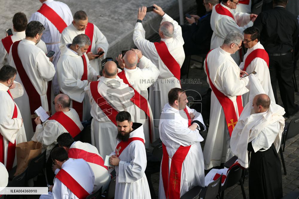 The faithful and priests wait on the steps of St Peter s Basilica for the Funeral of Pope Francis