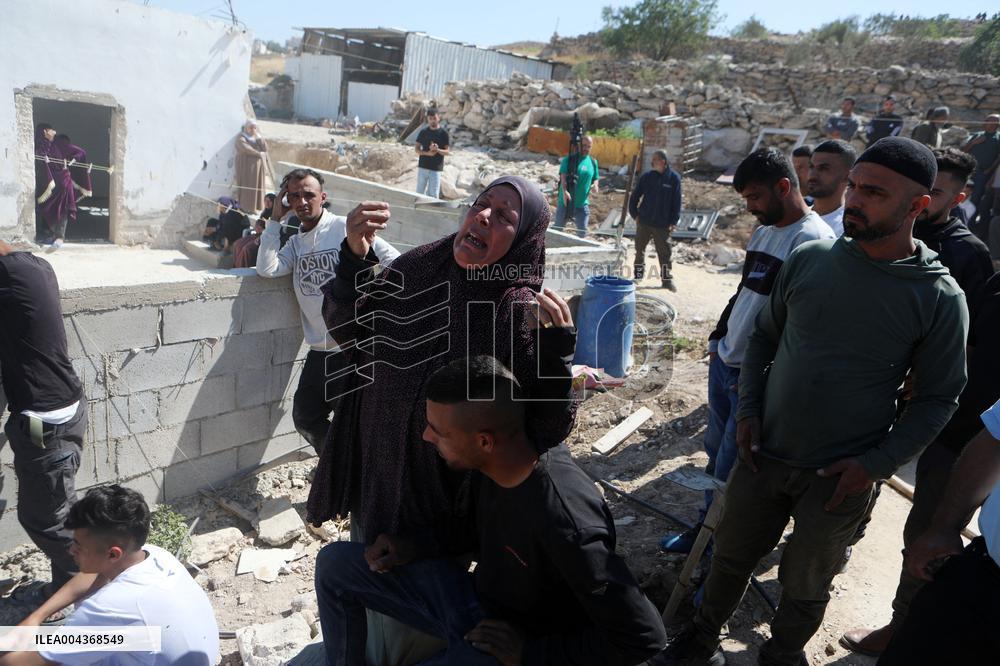 Israeli excavators demolish the houses in Hebron