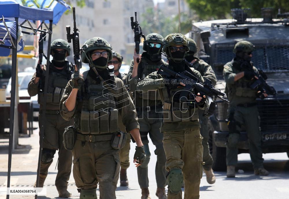 Israeli excavators demolish the houses in Hebron