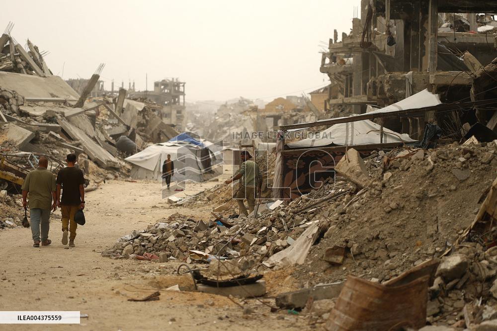 Palestinians Walking In A Sandstorm - Gaza