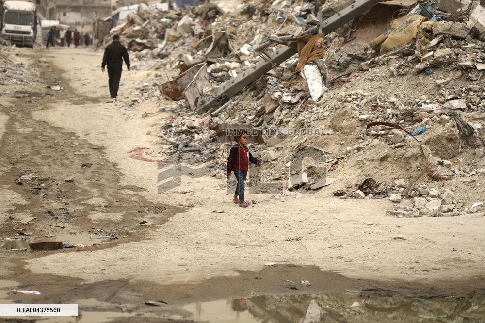 Palestinians Walking In A Sandstorm - Gaza