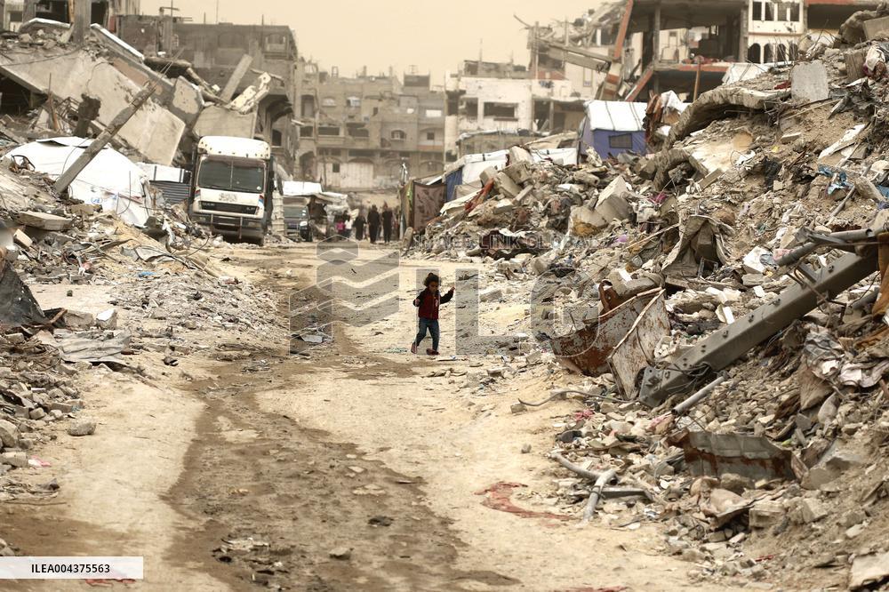 Palestinians Walking In A Sandstorm - Gaza