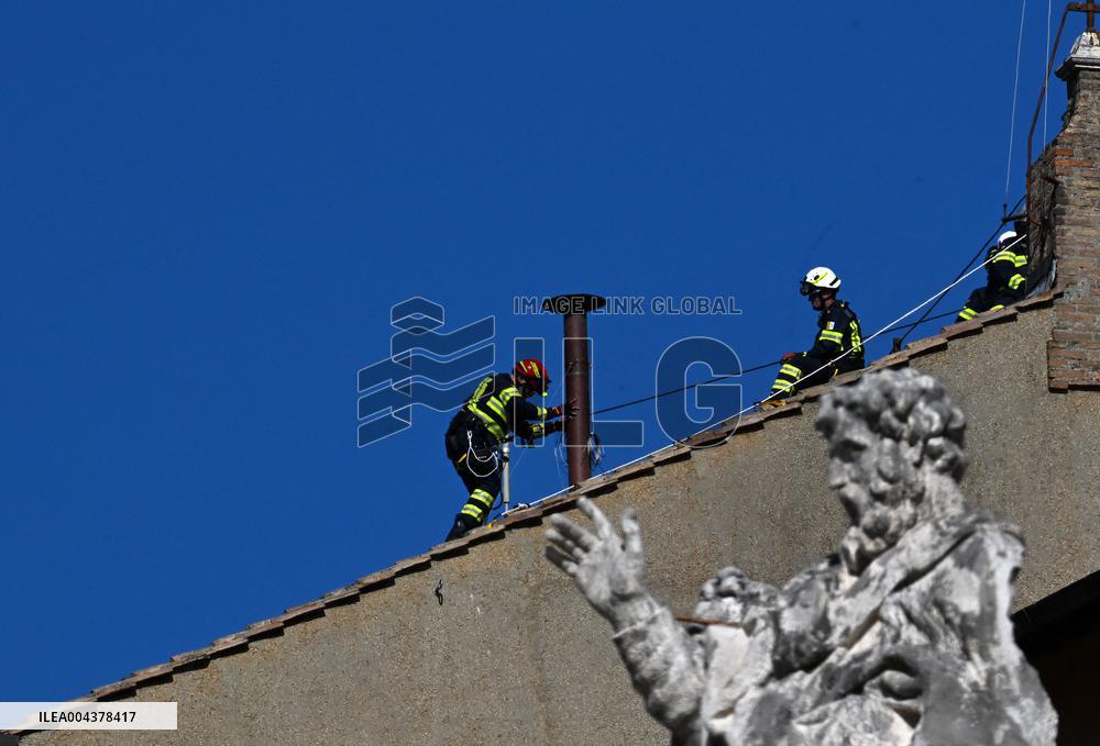 Firefighters Install Chimney On The Sistine Chapel For Papal Election - Vatican