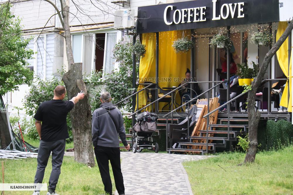 Shopping center, supermarket and residential building damaged by shelling in Kyiv