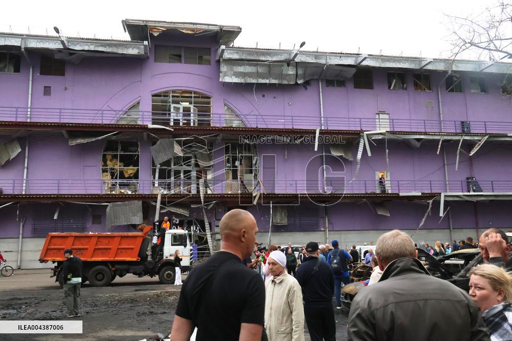 Shopping center, supermarket and residential building damaged by shelling in Kyiv