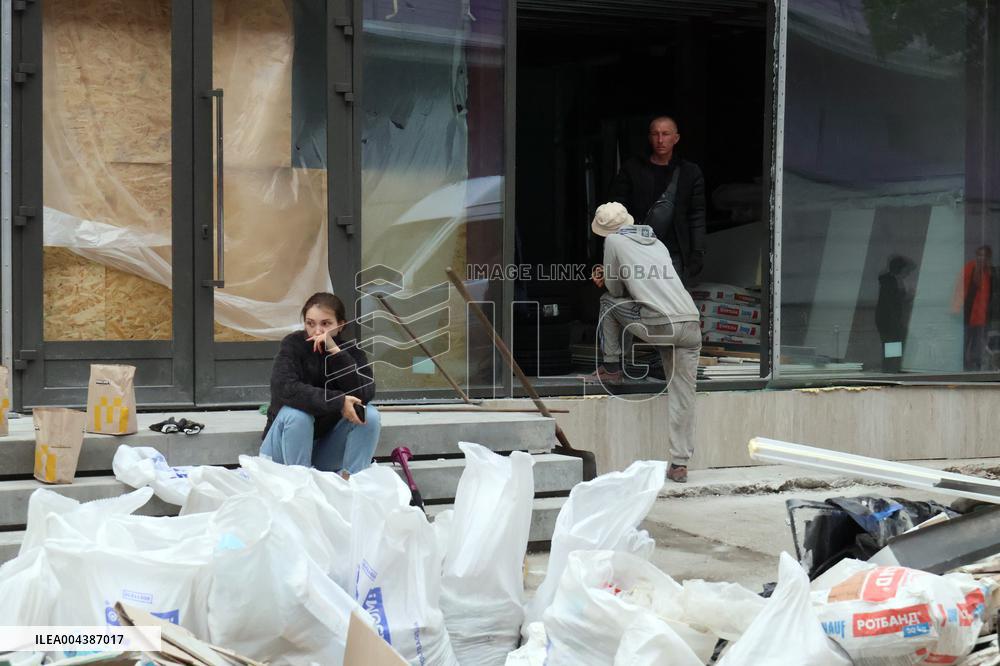Shopping center, supermarket and residential building damaged by shelling in Kyiv