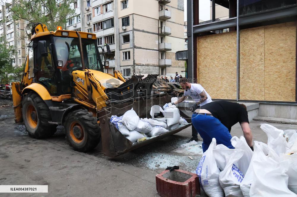 Shopping center, supermarket and residential building damaged by shelling in Kyiv