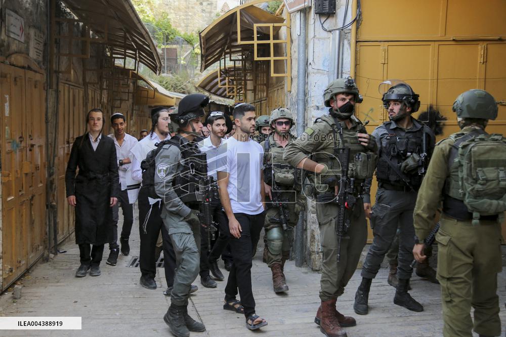 Israeli Forces Escort Settlers - Hebron