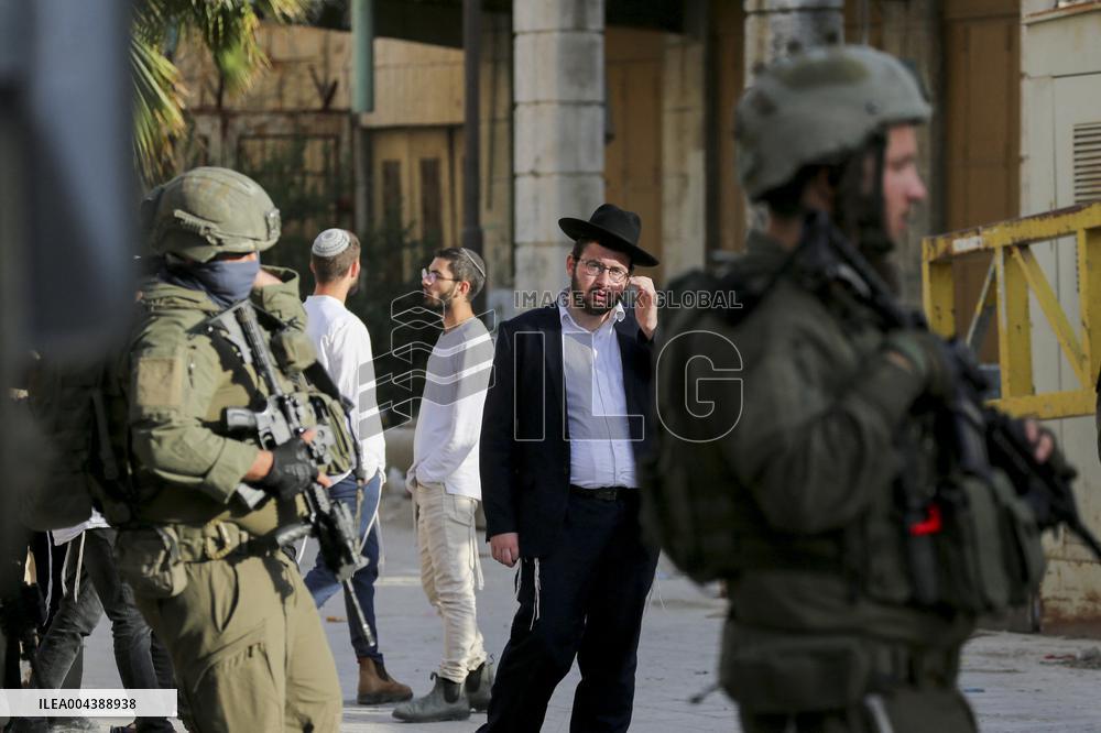 Israeli Forces Escort Settlers - Hebron
