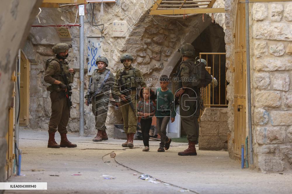 Israeli Forces Escort Settlers - Hebron