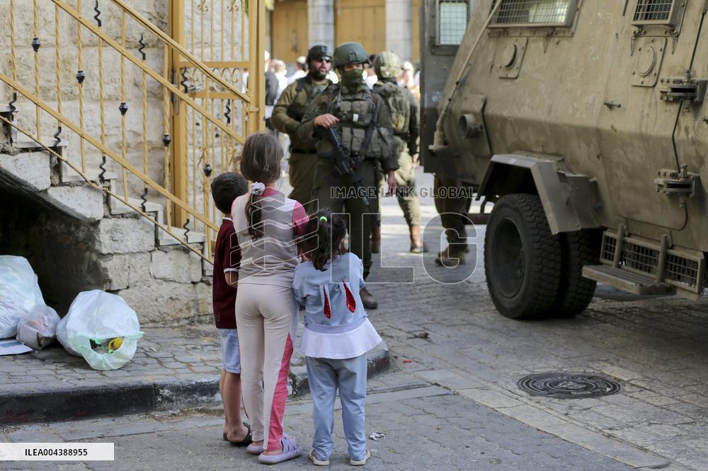 Israeli Forces Escort Settlers - Hebron