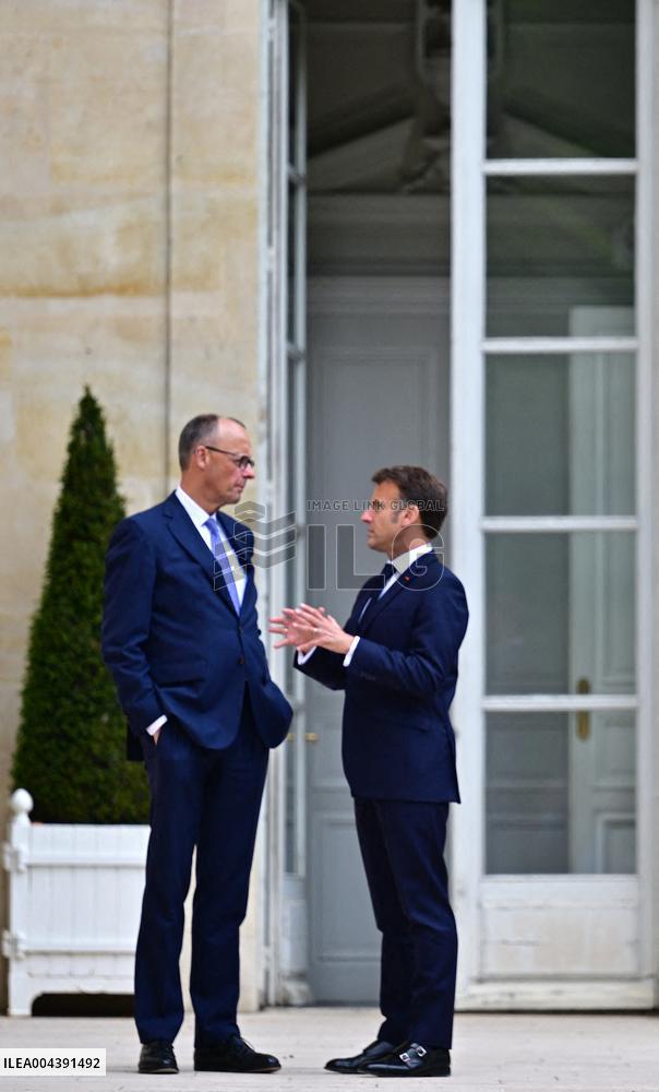 Macron and Merz Discuss in Elysee Garden - Paris