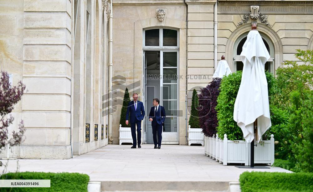 Macron and Merz Discuss in Elysee Garden - Paris