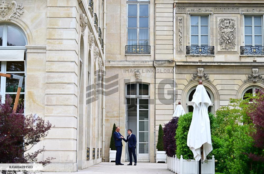 Macron and Merz Discuss in Elysee Garden - Paris