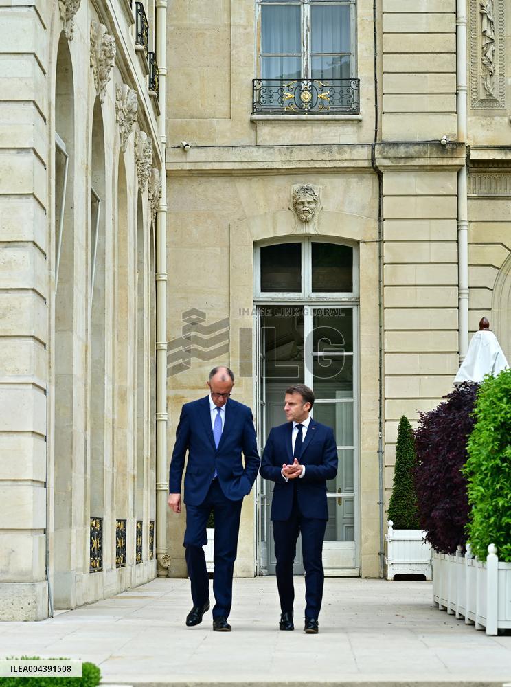 Macron and Merz Discuss in Elysee Garden - Paris
