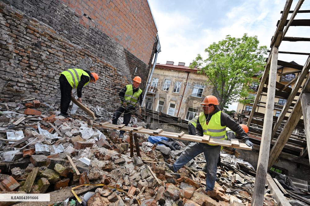 Building damaged by Russian attack gets dismantled in Lviv
