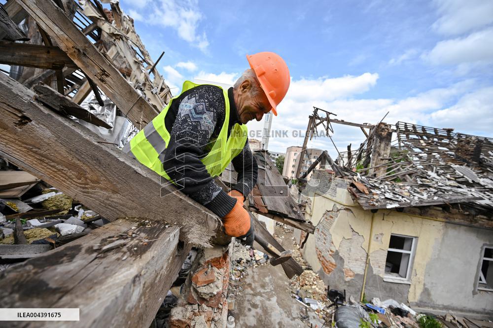 Building damaged by Russian attack gets dismantled in Lviv