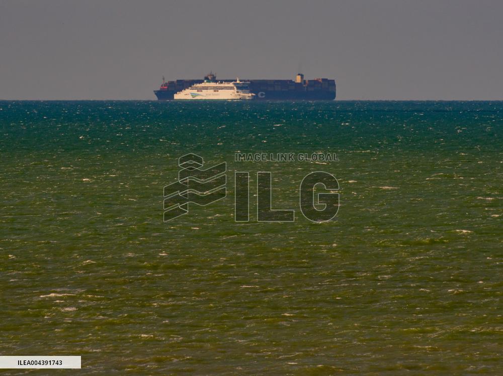 Container Ship Meets Ferry in the English Channel - France