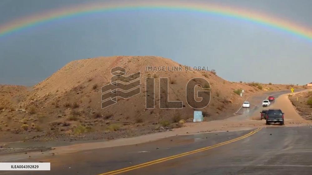 US: Rainbow Shines Over Flooded Road in Mojave Desert