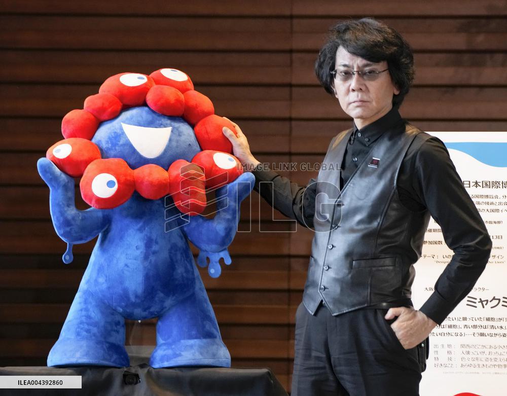 Roboticist Ishiguro with expo mascot