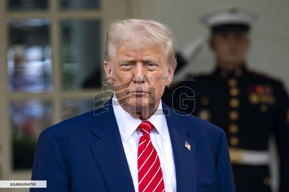 President Donald Trump Speaks with Reporters Outside Oval