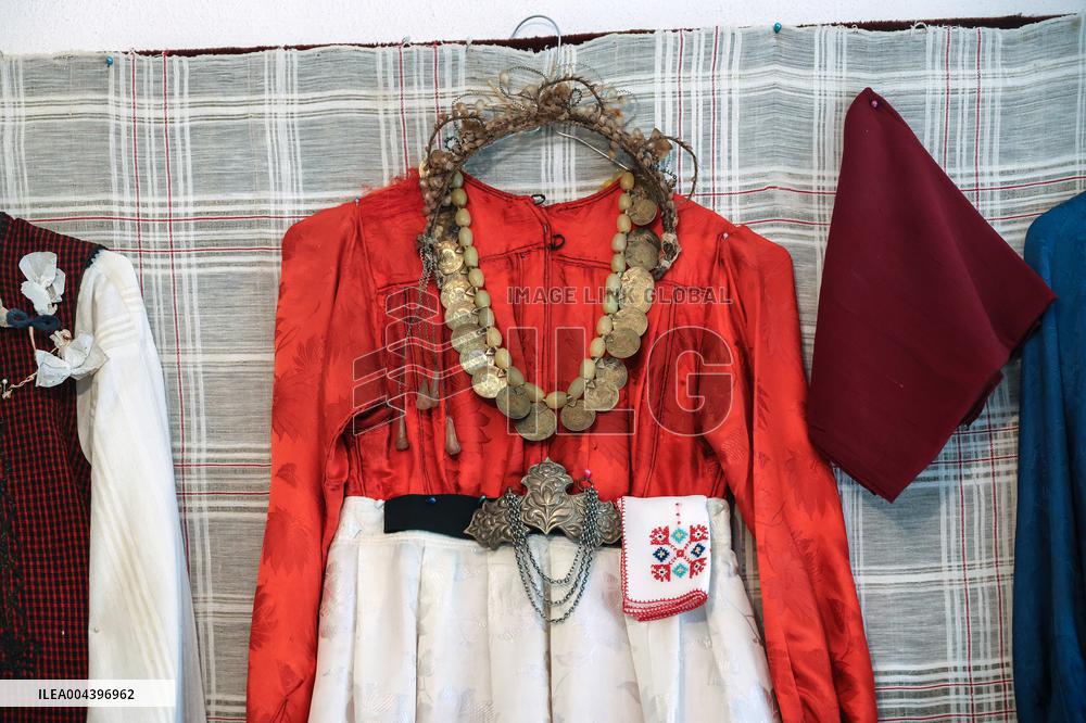 Collection of old Bulgarian towels, clothes and jewelry in Krynychne village