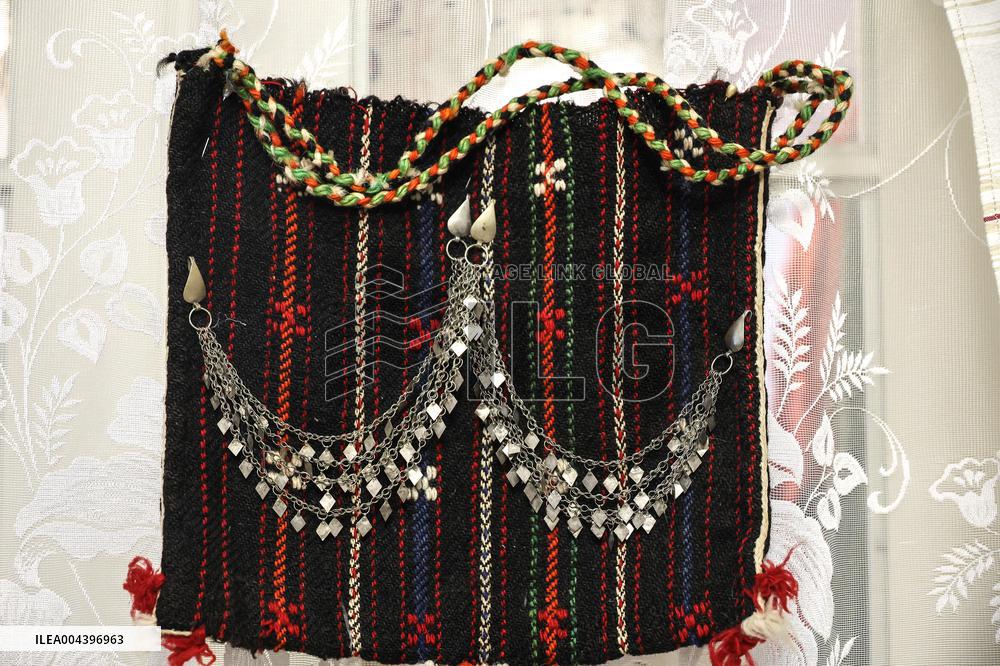 Collection of old Bulgarian towels, clothes and jewelry in Krynychne village