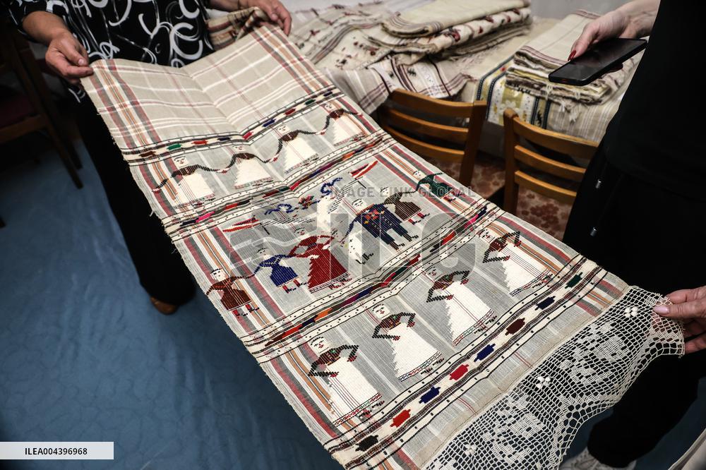 Collection of old Bulgarian towels, clothes and jewelry in Krynychne village