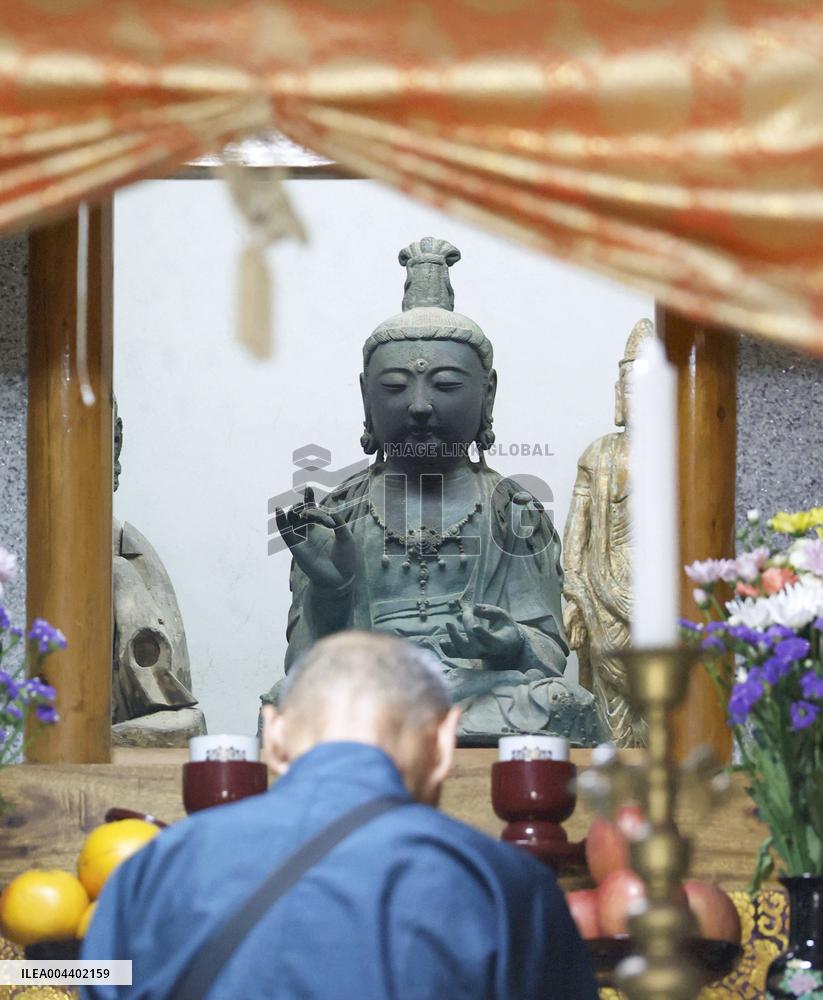 Stolen Buddhist statue returned to Japan
