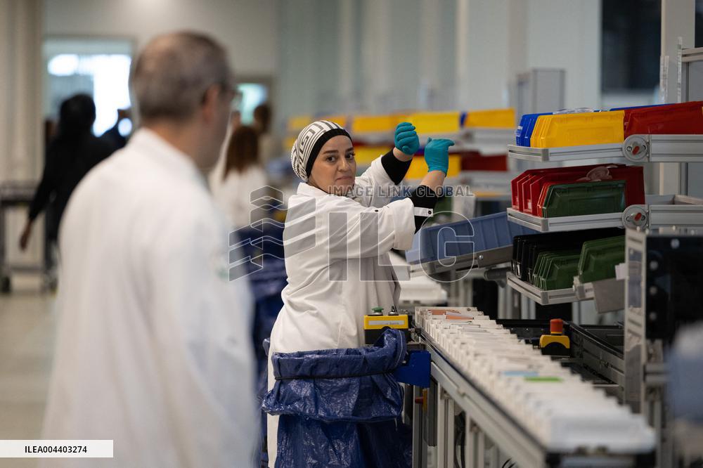 President Macron Visits EssilorLuxottica Laboratory - Wissous