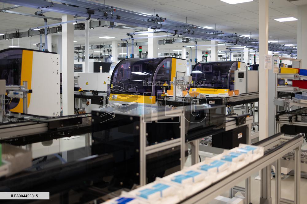 President Macron Visits EssilorLuxottica Laboratory - Wissous